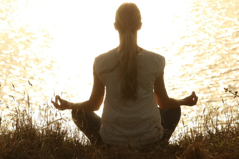 Woman practicing yoga outdoors
